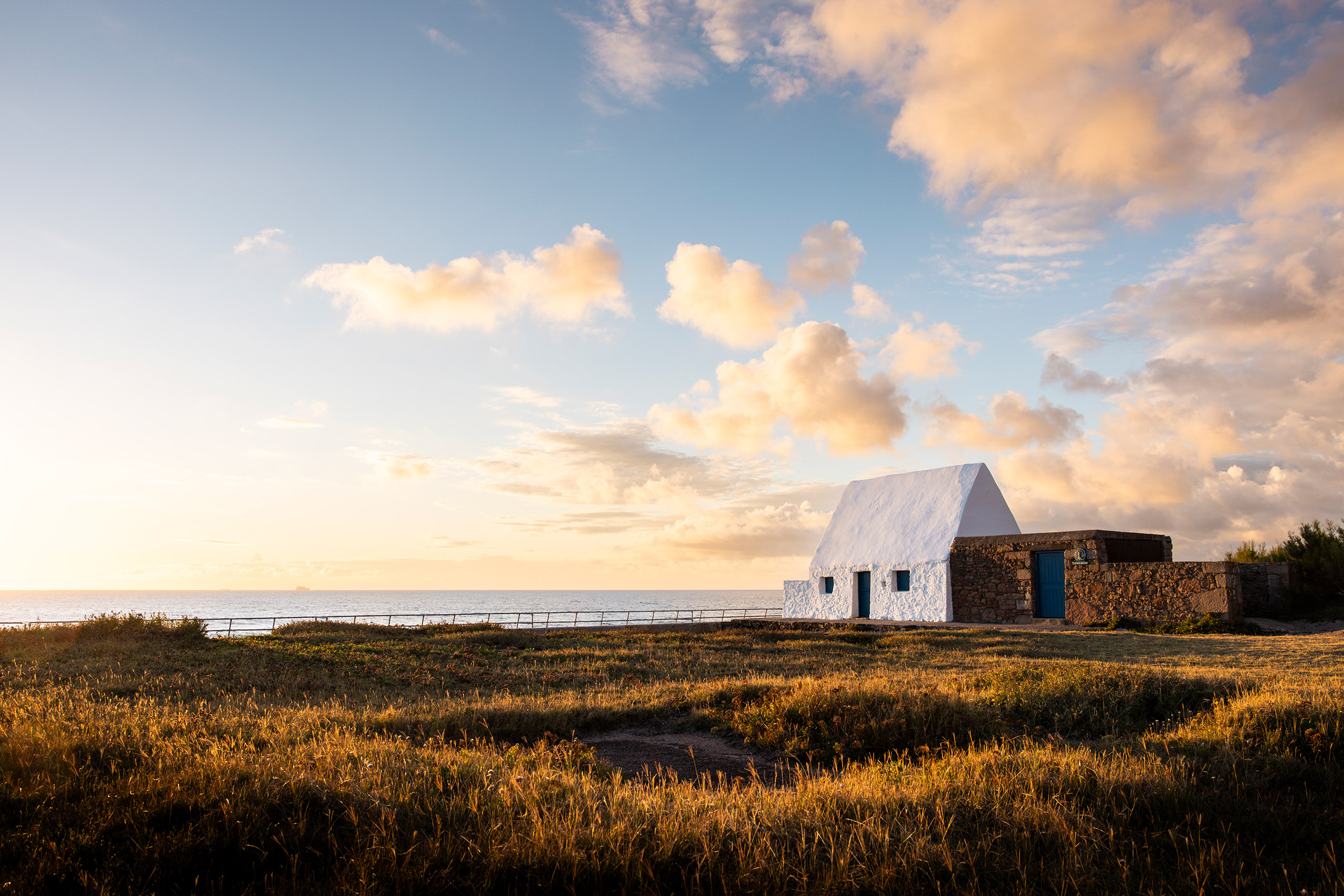 Jersey white house with landscape and sunset