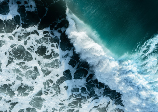 blue sea and white foaming waves
